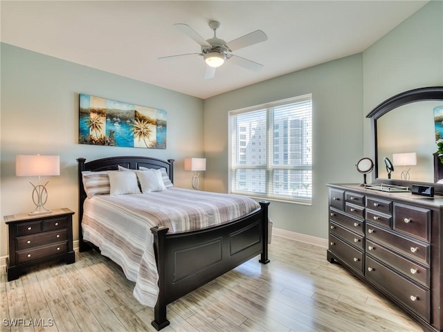 4182 Bay Beach Ln Unit 761, Fort Myers Beach, FL 33931 - bedroom featuring light wood-type flooring and a ceiling fan