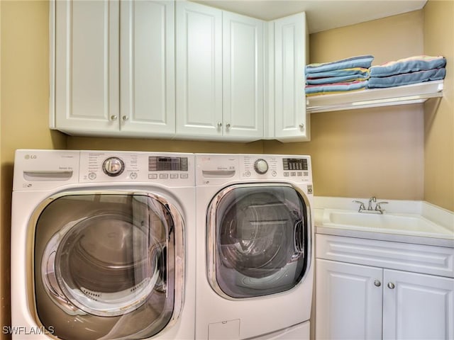 4182 Bay Beach Ln Unit 761, Fort Myers Beach, FL 33931 - laundry room featuring cabinet space and washing machine and dryer