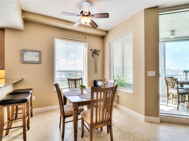 4182 Bay Beach Ln Unit 761, Fort Myers Beach, FL 33931 - dining room featuring a ceiling fan and light tile patterned floors