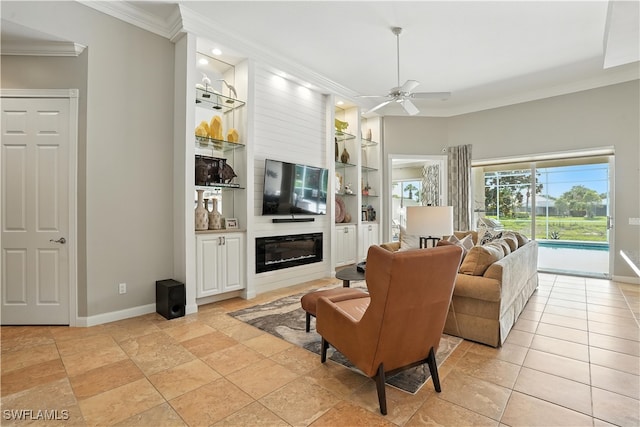 28283 Koi Way, Bonita Springs, FL 34135 - living room featuring crown molding, built in shelves, a ceiling fan, and a fireplace