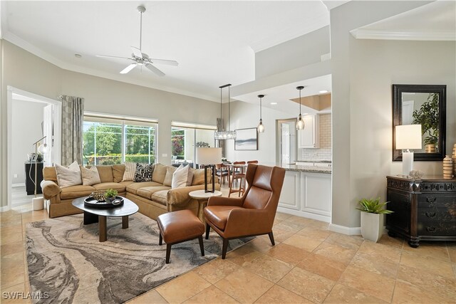 28283 Koi Way, Bonita Springs, FL 34135 - living room featuring ornamental molding, ceiling fan, and stone tile floors