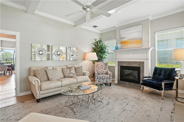 28283 Koi Way, Bonita Springs, FL 34135 - living room with beamed ceiling, wood finished floors, crown molding, a premium fireplace, and a ceiling fan