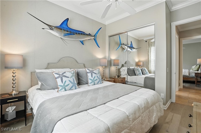 28283 Koi Way, Bonita Springs, FL 34135 - bedroom with crown molding, wood finished floors, a closet, a ceiling fan, and radiator
