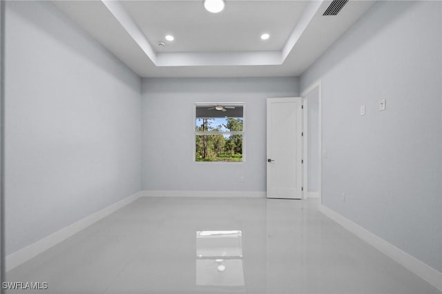 3433 66th Ave NE, Naples, FL 34120 - unfurnished room featuring a raised ceiling, recessed lighting, and tile patterned floors