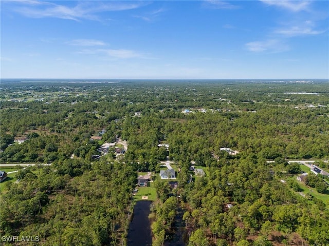 3433 66th Ave NE, Naples, FL 34120 - view of property location with a heavily wooded area