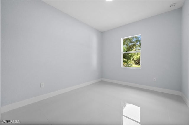 3433 66th Ave NE, Naples, FL 34120 - spare room featuring a smoke detector and baseboards