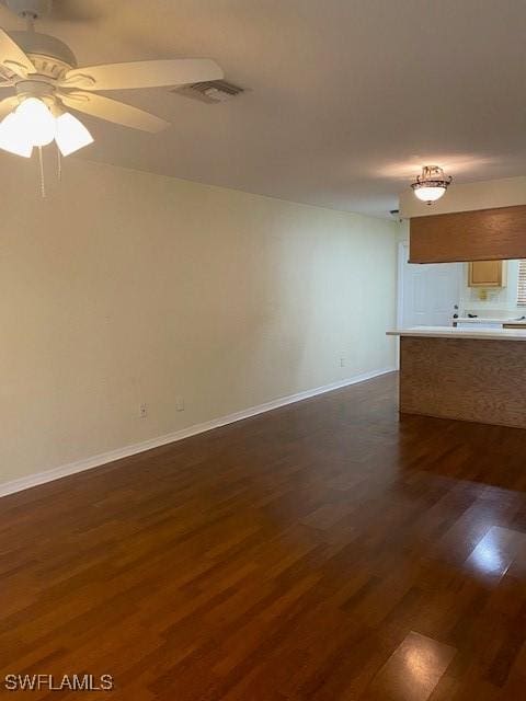 5265 Leeds Rd, Fort Myers, FL 33907 - unfurnished living room featuring dark wood-type flooring and ceiling fan