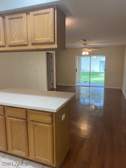 5265 Leeds Rd, Fort Myers, FL 33907 - kitchen featuring a ceiling fan, light countertops, wood finished floors, and open floor plan
