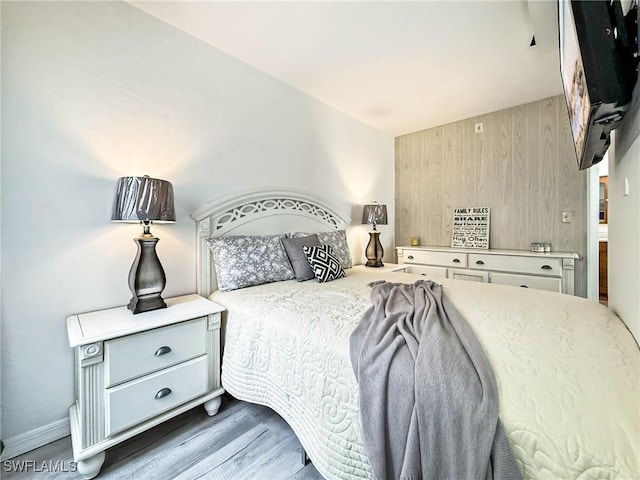 13126 Feather Sound Dr Unit 310, Fort Myers, FL 34481 - bedroom with wood finished floors and wood walls