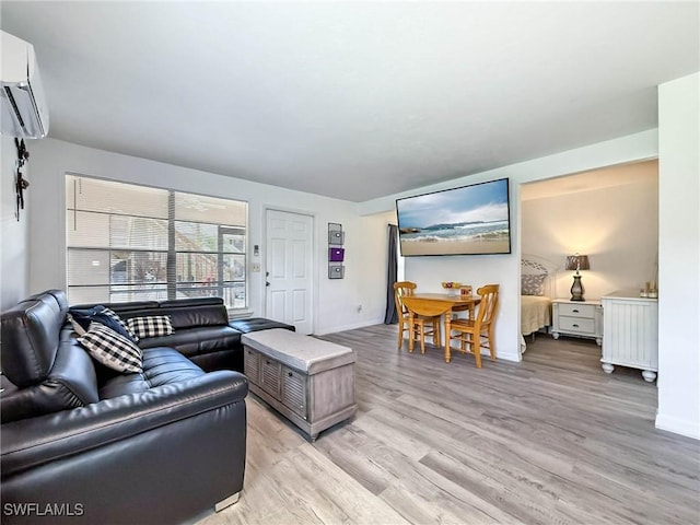 13126 Feather Sound Dr Unit 310, Fort Myers, FL 34481 - living room with a wall mounted AC and light wood-type flooring
