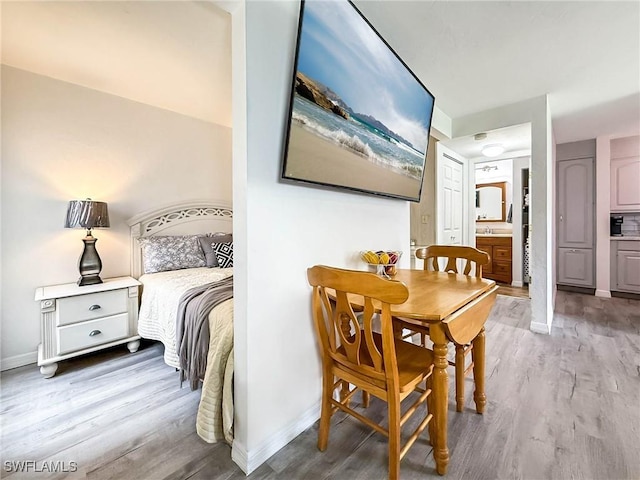 13126 Feather Sound Dr Unit 310, Fort Myers, FL 34481 - bedroom with wood finished floors and baseboards