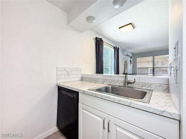 13126 Feather Sound Dr Unit 310, Fort Myers, FL 34481 - kitchen featuring black dishwasher, light countertops, white cabinetry, and a wall unit AC