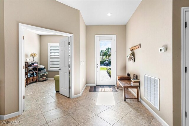 9078 Triangle Palm Ln, Fort Myers, FL 33913 - foyer with light tile patterned floors