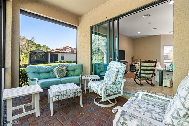 9078 Triangle Palm Ln, Fort Myers, FL 33913 - view of patio with an outdoor hangout area