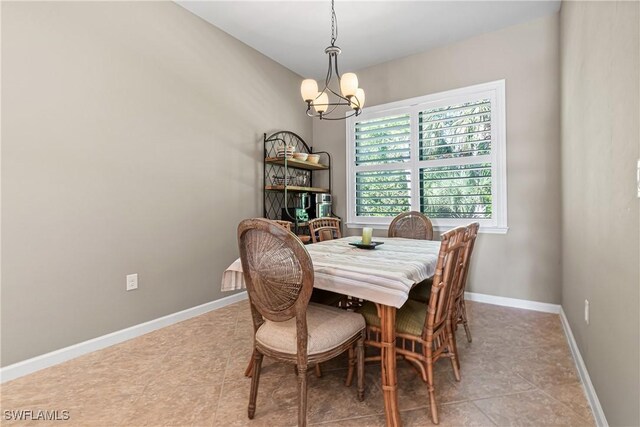9078 Triangle Palm Ln, Fort Myers, FL 33913 - dining area with a chandelier and baseboards