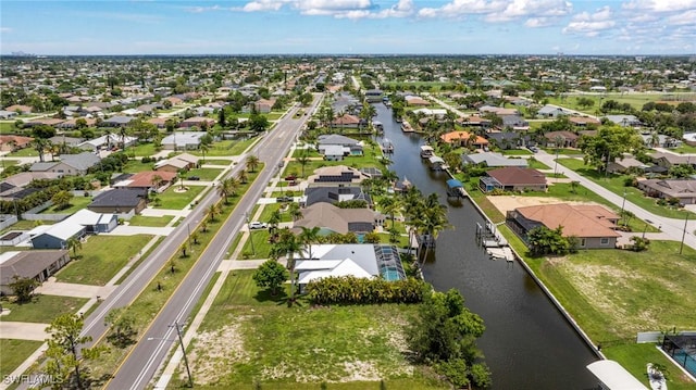 606 Mohawk Pkwy, Cape Coral, FL 33914 - aerial perspective of suburban area featuring a large body of water