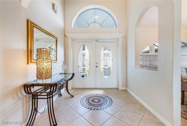 606 Mohawk Pkwy, Cape Coral, FL 33914 - foyer featuring arched walkways, light tile patterned floors, and a high ceiling