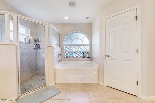 606 Mohawk Pkwy, Cape Coral, FL 33914 - full bath with tile patterned floors, a stall shower, and a garden tub