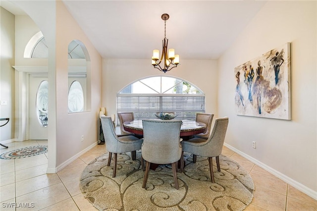 606 Mohawk Pkwy, Cape Coral, FL 33914 - dining room with light tile patterned flooring, a chandelier, and lofted ceiling