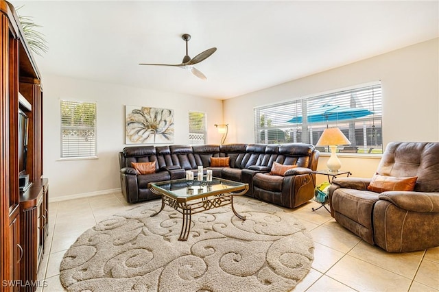 606 Mohawk Pkwy, Cape Coral, FL 33914 - living room featuring light tile patterned flooring, a ceiling fan, and healthy amount of natural light