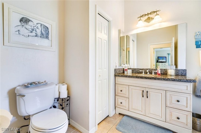 606 Mohawk Pkwy, Cape Coral, FL 33914 - bathroom with a closet, vanity, and tile patterned flooring