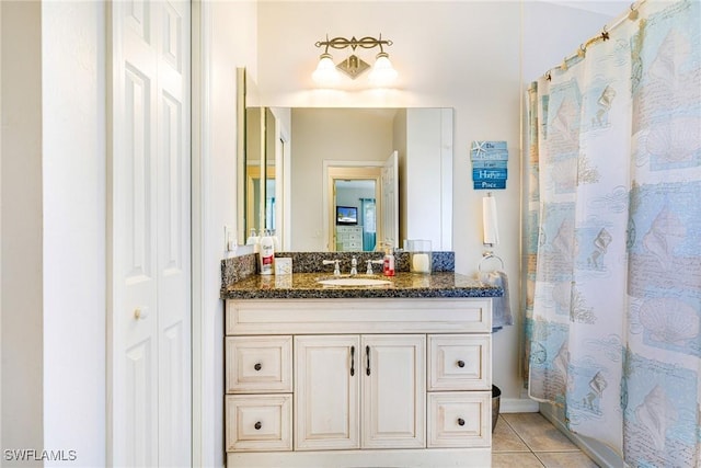 606 Mohawk Pkwy, Cape Coral, FL 33914 - full bathroom featuring vanity, tile patterned floors, and a shower with shower curtain