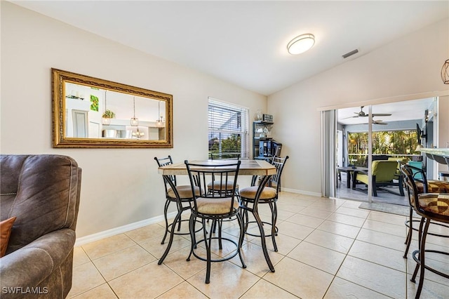 606 Mohawk Pkwy, Cape Coral, FL 33914 - dining space with vaulted ceiling, light tile patterned flooring, and a ceiling fan