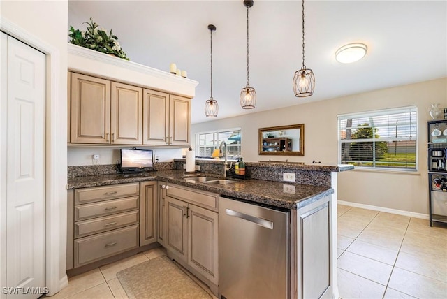 606 Mohawk Pkwy, Cape Coral, FL 33914 - kitchen with stainless steel dishwasher, a peninsula, light tile patterned floors, pendant lighting, and dark stone countertops