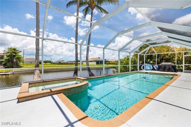606 Mohawk Pkwy, Cape Coral, FL 33914 - view of pool with a pool with connected hot tub, a water view, glass enclosure, and a patio