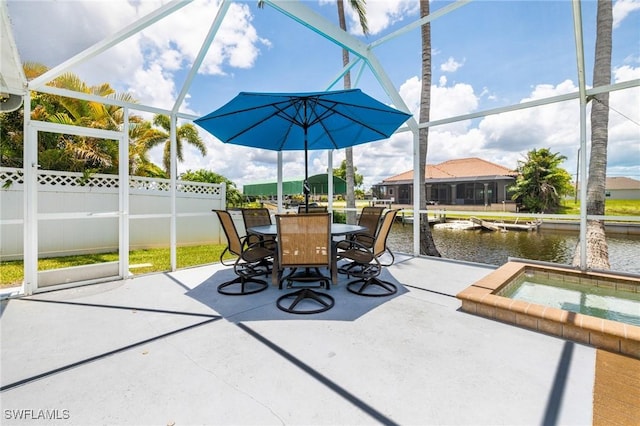 606 Mohawk Pkwy, Cape Coral, FL 33914 - view of patio featuring an in-ground hot tub, a water view, glass enclosure, and outdoor dining area