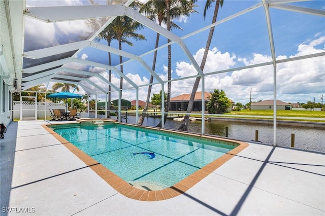 606 Mohawk Pkwy, Cape Coral, FL 33914 - view of pool featuring a patio, a pool with connected hot tub, a water view, and glass enclosure