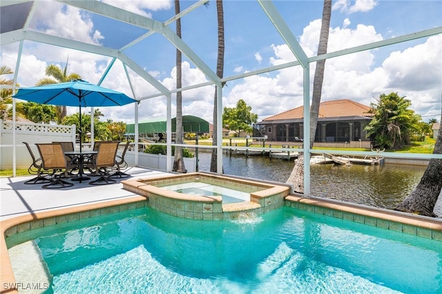 606 Mohawk Pkwy, Cape Coral, FL 33914 - view of swimming pool featuring a patio, a water view, a pool with connected hot tub, and a lanai