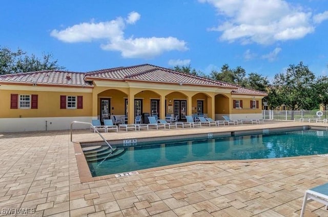 4105 Residence Dr Unit 722, Fort Myers, FL 33901 - community pool featuring a patio area