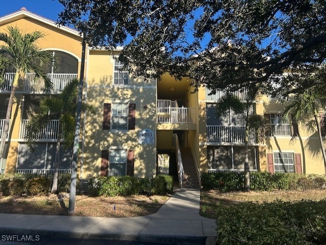 4105 Residence Dr Unit 722, Fort Myers, FL 33901 - view of property with stairway