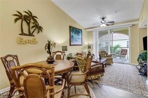 4105 Residence Dr Unit 722, Fort Myers, FL 33901 - dining area with lofted ceiling, ceiling fan, and wood finished floors