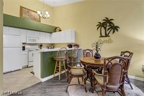 4105 Residence Dr Unit 722, Fort Myers, FL 33901 - dining space featuring a chandelier