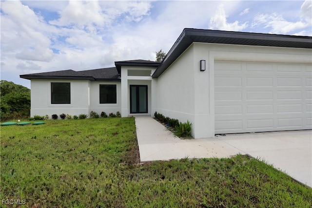2713 8th St W, Lehigh Acres, FL 33971 - view of front of home with a front yard, stucco siding, a garage, and driveway