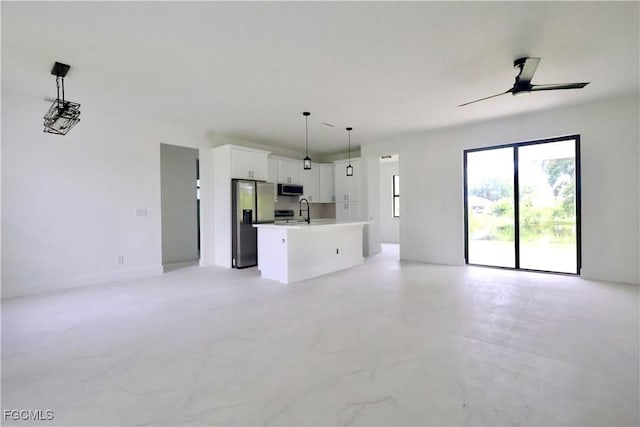 2713 8th St W, Lehigh Acres, FL 33971 - unfurnished living room with ceiling fan