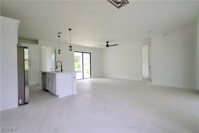 2713 8th St W, Lehigh Acres, FL 33971 - unfurnished living room featuring a ceiling fan and a sink