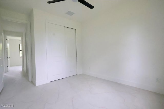 2713 8th St W, Lehigh Acres, FL 33971 - unfurnished bedroom with a closet and ceiling fan