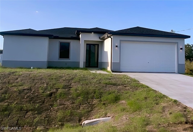 3113 58th St W, Lehigh Acres, FL 33971 - view of front of property featuring stucco siding, driveway, and an attached garage