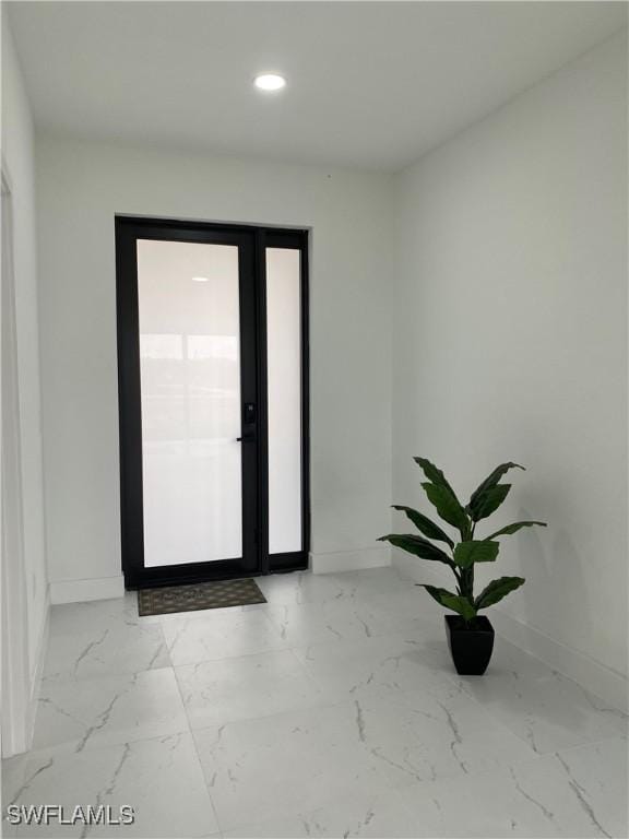 3113 58th St W, Lehigh Acres, FL 33971 - empty room featuring light marble finish flooring and recessed lighting