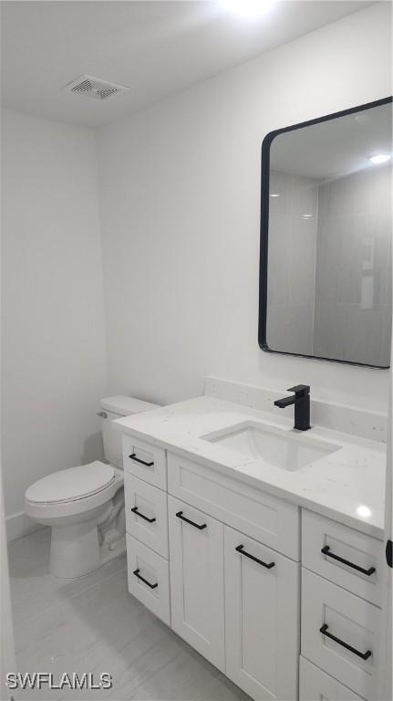 1215 Bayou St, Lehigh Acres, FL 33974 - bathroom with vanity and toilet