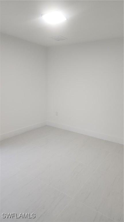 1215 Bayou St, Lehigh Acres, FL 33974 - spare room with baseboards