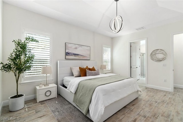 3240 Pilot Cir, Naples, FL 34120 - bedroom featuring wood tiled floors and baseboards