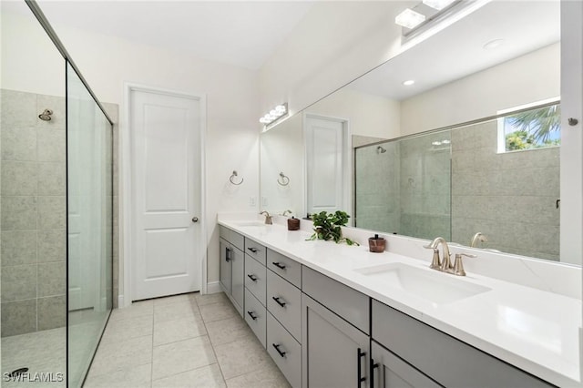 3240 Pilot Cir, Naples, FL 34120 - full bathroom with double vanity, tiled shower, and tile patterned flooring
