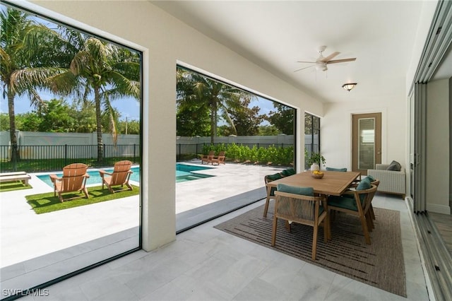 3240 Pilot Cir, Naples, FL 34120 - sunroom with ceiling fan and outdoor dining area