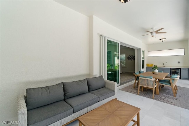 3240 Pilot Cir, Naples, FL 34120 - living area with beverage cooler and ceiling fan