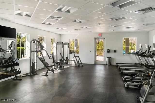 3240 Pilot Cir, Naples, FL 34120 - gym featuring a paneled ceiling