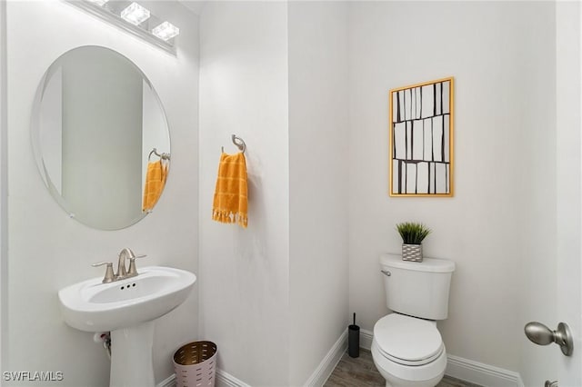 3240 Pilot Cir, Naples, FL 34120 - bathroom with toilet and baseboards